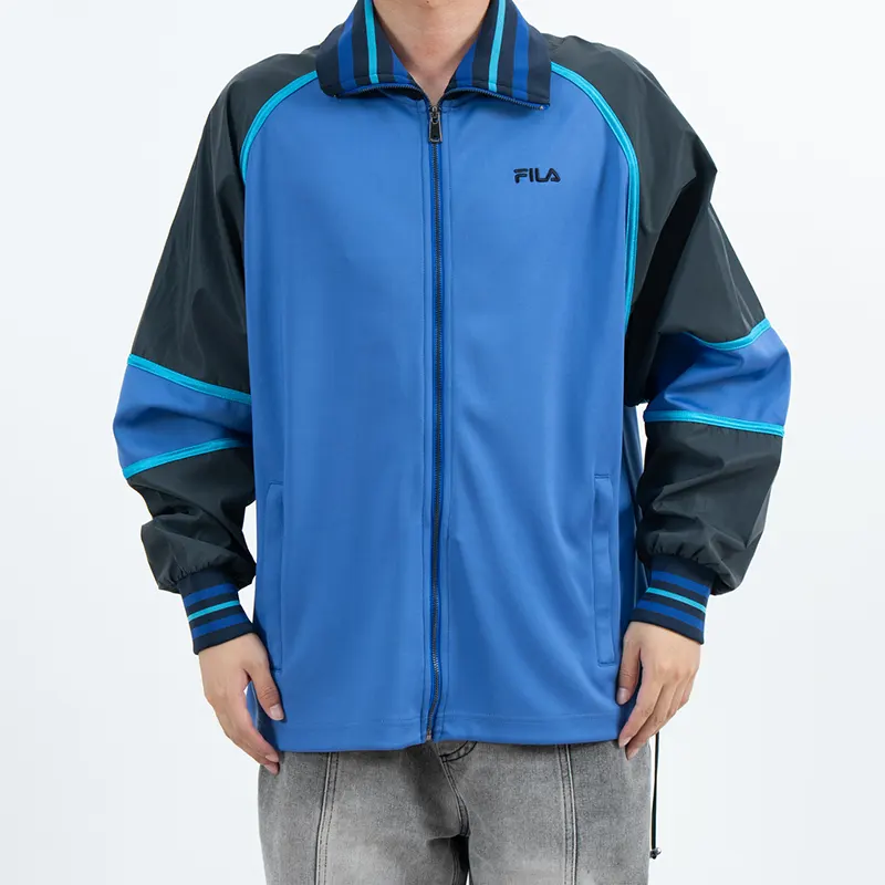 Veste Hardshell d'extérieur bleue à blocs de couleurs avec col et poignets rayés